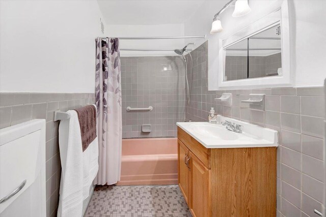 4320 E Van Cortlandt Park E Unit 5E, Bronx, NY 10470 - full bath featuring tile walls, vanity, shower / tub combo with curtain, tile patterned floors, and wainscoting