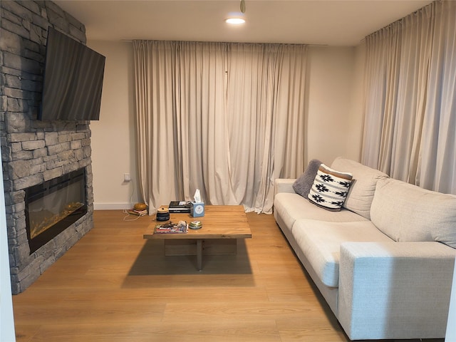 7 Fayer Ct, Phillipsport, NY 12769 - living area with a fireplace, light wood finished floors, recessed lighting, and baseboards