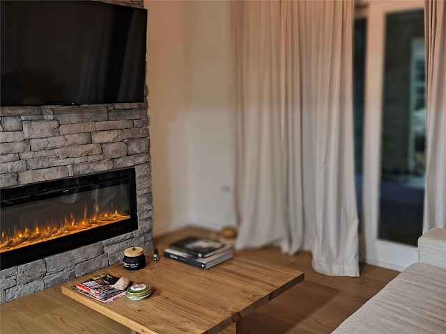 7 Fayer Ct, Phillipsport, NY 12769 - living area featuring a fireplace, wood finished floors, and baseboards