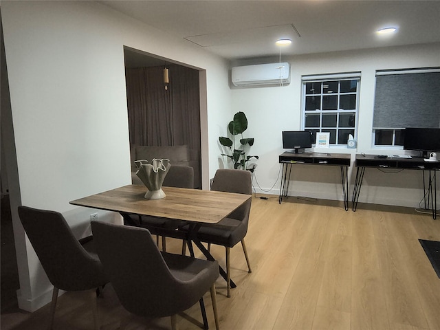 7 Fayer Ct, Phillipsport, NY 12769 - dining area with an AC wall unit, light wood-type flooring, an office area, and baseboards
