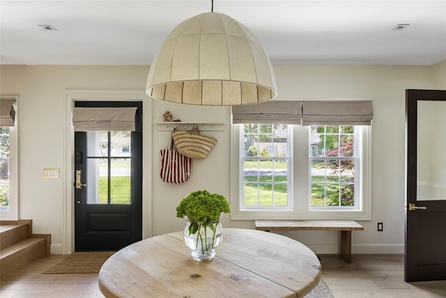 350 Skunk Ln, Cutchogue, NY 11935 - dining room featuring light wood-type flooring and baseboards