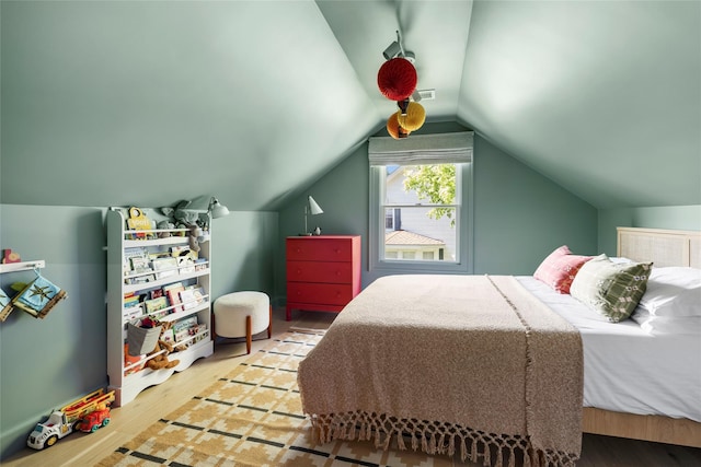 350 Skunk Ln, Cutchogue, NY 11935 - bedroom featuring wood finished floors and vaulted ceiling