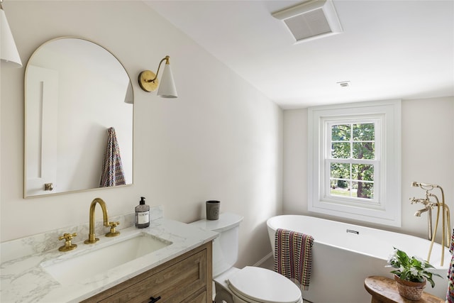 350 Skunk Ln, Cutchogue, NY 11935 - full bath featuring vanity, a freestanding tub, and toilet