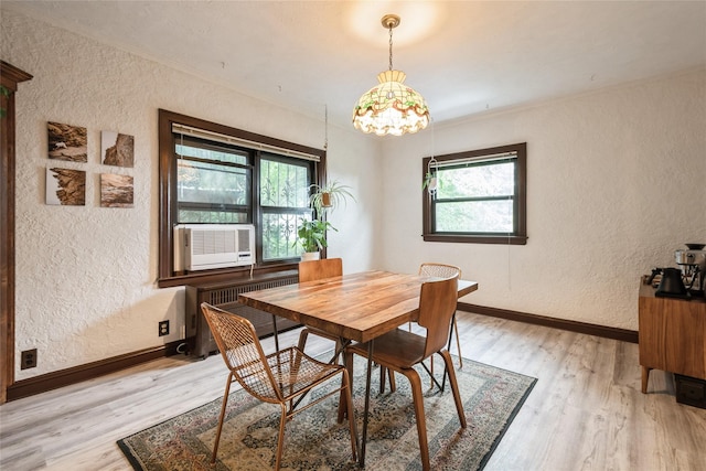 25 Cliffside Dr, Yonkers, NY 10710 - dining area with a textured wall, light wood-style flooring, cooling unit, radiator heating unit, and crown molding