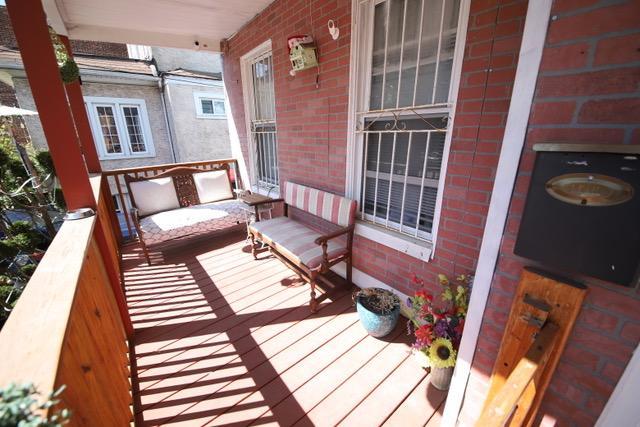 228 N 5th Ave, Mount Vernon, NY 10550 - wooden deck with a porch