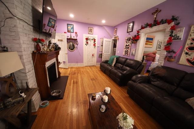 228 N 5th Ave, Mount Vernon, NY 10550 - living area with a fireplace with raised hearth and light wood-style floors