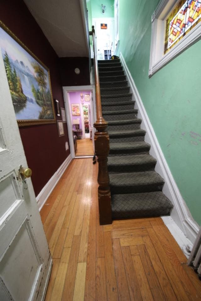 228 N 5th Ave, Mount Vernon, NY 10550 - staircase featuring hardwood / wood-style flooring and baseboards