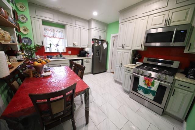 228 N 5th Ave, Mount Vernon, NY 10550 - kitchen with appliances with stainless steel finishes, a sink, light countertops, and recessed lighting