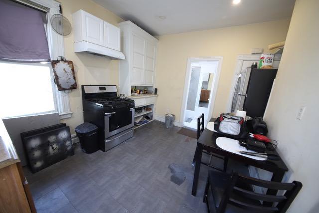 228 N 5th Ave, Mount Vernon, NY 10550 - kitchen featuring gas range and white cabinets
