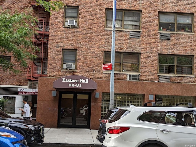94-31 59th Ave Unit 4B, Elmhurst, NY 11373 - view of building exterior with cooling unit