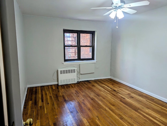 94-31 59th Ave Unit 4B, Elmhurst, NY 11373 - empty room featuring hardwood / wood-style floors, ceiling fan, radiator, and baseboards