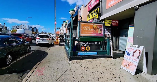 94-31 59th Ave Unit 4B, Elmhurst, NY 11373 - view of asphalt street featuring street lights and traffic lights
