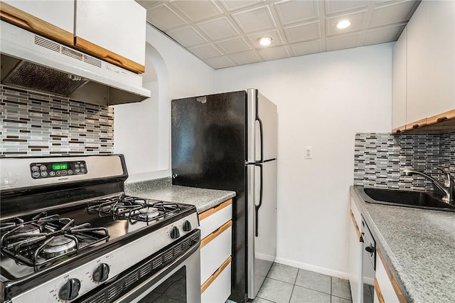 397 N Broadway Unit 3E, Yonkers, NY 10701 - kitchen featuring stainless steel gas range oven, under cabinet range hood, recessed lighting, a sink, and freestanding refrigerator