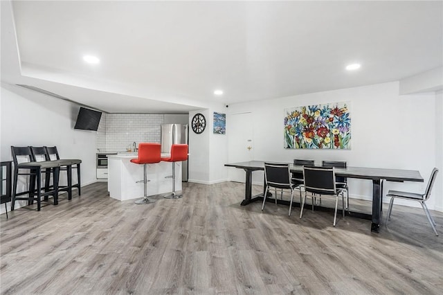 397 N Broadway Unit 3E, Yonkers, NY 10701 - dining space featuring light wood finished floors, recessed lighting, and baseboards