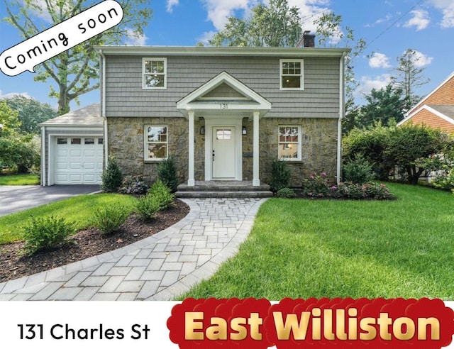 131 Charles St, East Williston, NY 11596 - colonial-style house featuring stone siding, a front yard, a chimney, a garage, and driveway