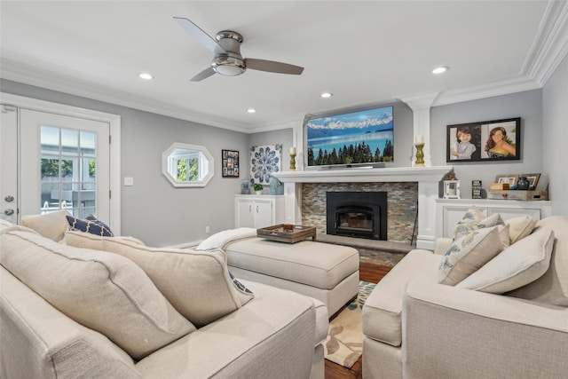26 Wilson St, Port Jefferson Station, NY 11776 - living area featuring crown molding, dark wood finished floors, ceiling fan, recessed lighting, and a stone fireplace