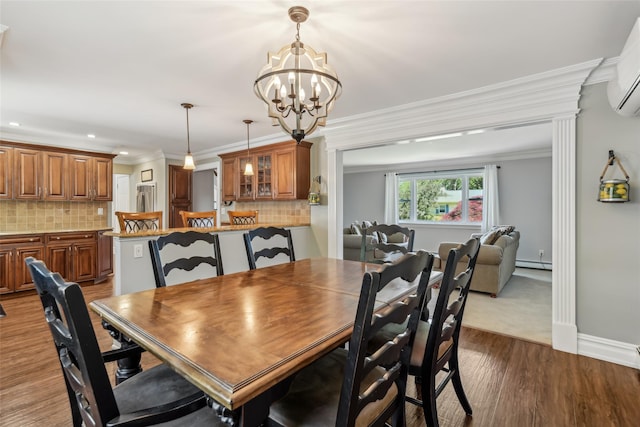 26 Wilson St, Port Jefferson Station, NY 11776 - dining room with baseboard heating, ornamental molding, dark wood finished floors, a chandelier, and recessed lighting
