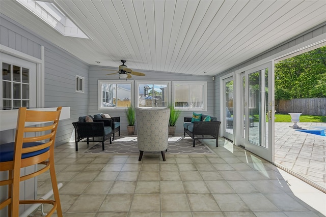 26 Wilson St, Port Jefferson Station, NY 11776 - sunroom featuring a skylight, wood ceiling, and wooden walls