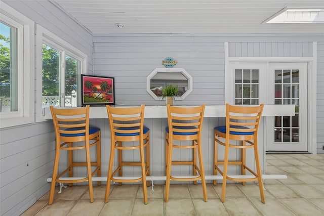 26 Wilson St, Port Jefferson Station, NY 11776 - bar area featuring wooden walls and tile patterned floors