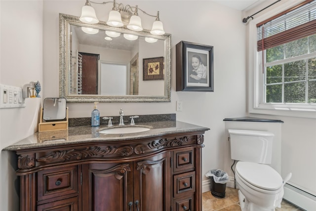 26 Wilson St, Port Jefferson Station, NY 11776 - bathroom featuring baseboard heating, vanity, toilet, and baseboards