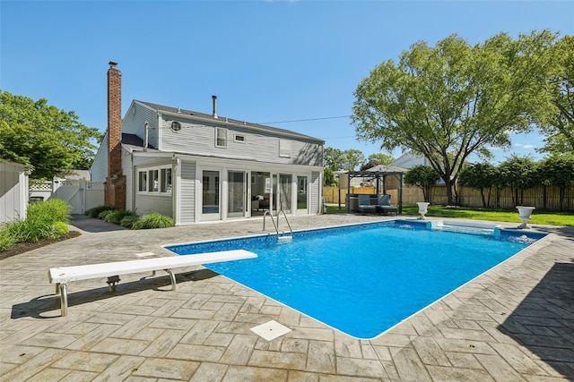 26 Wilson St, Port Jefferson Station, NY 11776 - view of swimming pool featuring a gazebo, a gate, a fenced backyard, a patio area, and a diving board