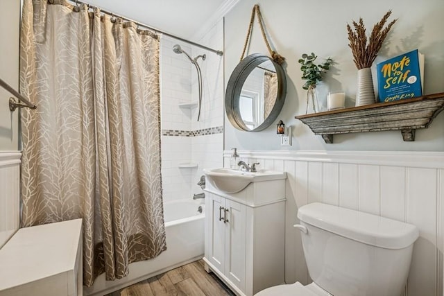 2660 Rosebud Ave, Merrick, NY 11566 - bathroom featuring wood finished floors, shower / bathtub combination with curtain, vanity, toilet, and wainscoting