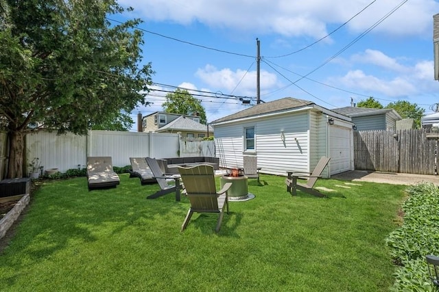 2660 Rosebud Ave, Merrick, NY 11566 - view of yard featuring an outdoor fire pit, driveway, and an outbuilding