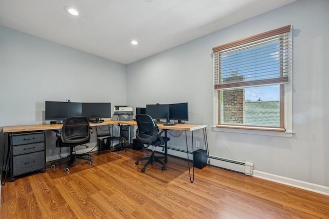 2660 Rosebud Ave, Merrick, NY 11566 - office area with wood finished floors, baseboards, recessed lighting, and a baseboard heating unit