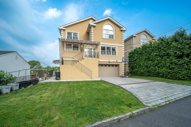 580 Valley Ave, Yonkers, NY 10703 - view of front facade featuring stucco siding, concrete driveway, an attached garage, and stairway