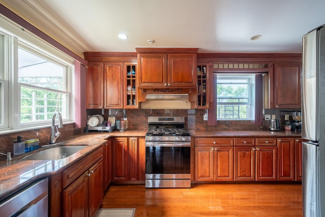 580 Valley Ave, Yonkers, NY 10703 - kitchen featuring appliances with stainless steel finishes, healthy amount of natural light, tasteful backsplash, glass insert cabinets, and recessed lighting