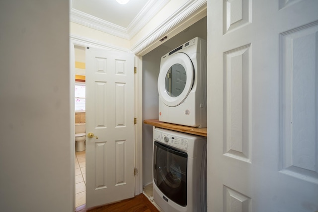 580 Valley Ave, Yonkers, NY 10703 - washroom with stacked washer / dryer and crown molding