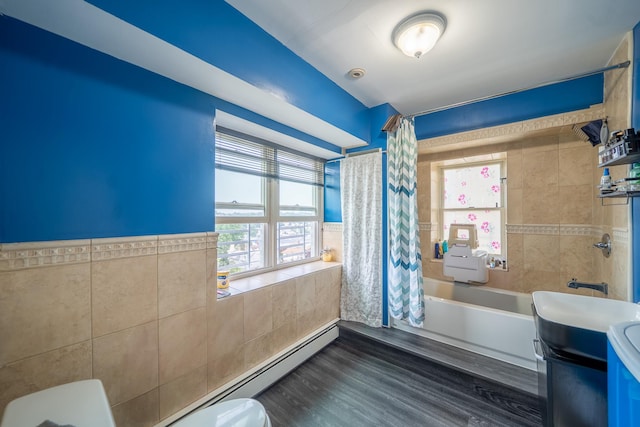 580 Valley Ave, Yonkers, NY 10703 - full bathroom featuring shower / bath combination with curtain, vanity, tile walls, wood finished floors, and a baseboard radiator
