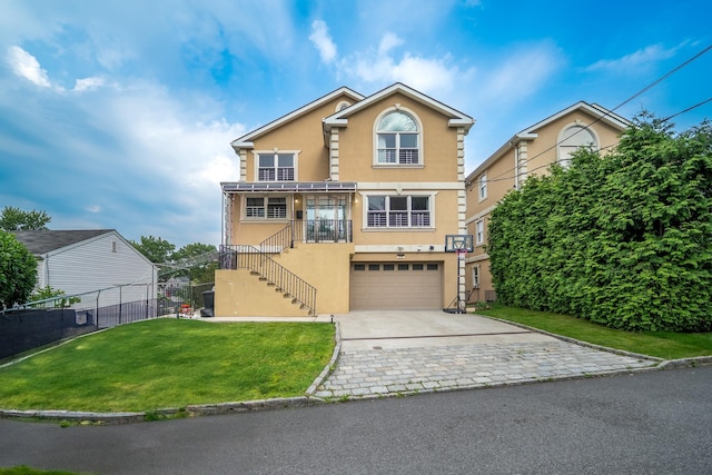 580 Valley Ave, Yonkers, NY 10703 - view of front of property featuring stucco siding, driveway, a garage, and stairs