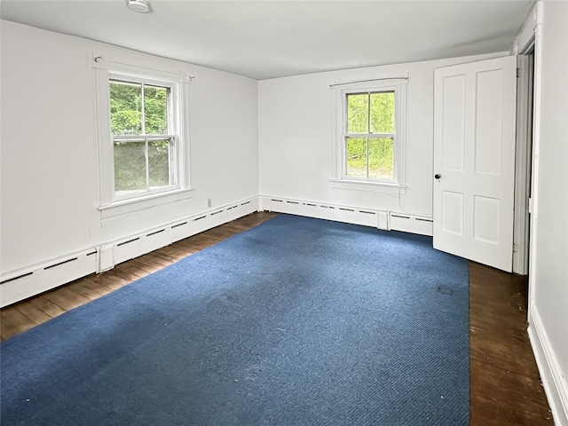 9 Church St, Hyde Park, NY 12538 - unfurnished room with healthy amount of natural light, wood finished floors, baseboards, and a baseboard radiator