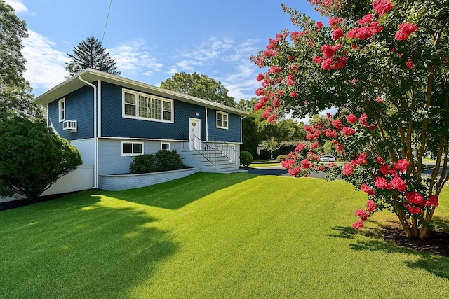 18 Park Dr E, Syosset, NY 11791 - raised ranch with a front yard, cooling unit, and brick siding