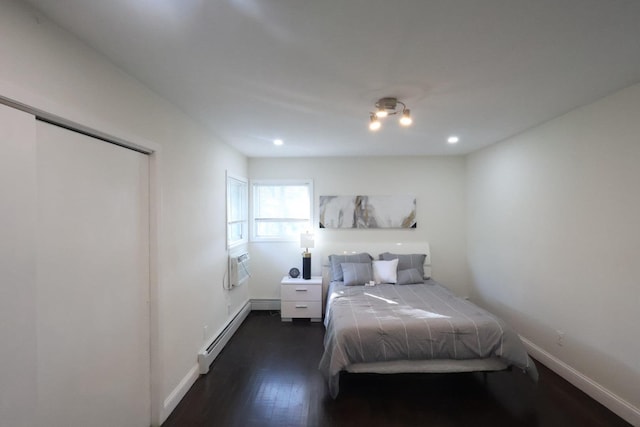 18 Park Dr E, Syosset, NY 11791 - bedroom featuring a baseboard heating unit, dark wood finished floors, baseboards, and recessed lighting