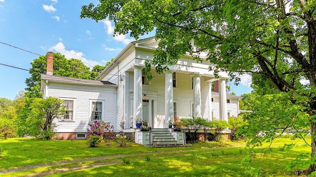 9 Ireland Ave, Wappingers Falls, NY 12590 - neoclassical / greek revival house with a front lawn, a porch, and a chimney