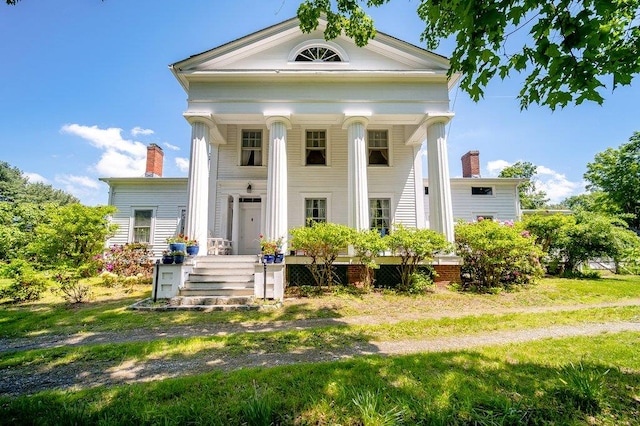 9 Ireland Ave, Wappingers Falls, NY 12590 - neoclassical / greek revival house featuring a chimney and a porch