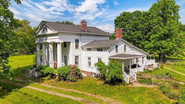 9 Ireland Ave, Wappingers Falls, NY 12590 - rear view of property featuring a porch and a chimney