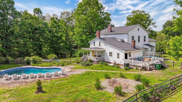9 Ireland Ave, Wappingers Falls, NY 12590 - back of house with a chimney and a deck