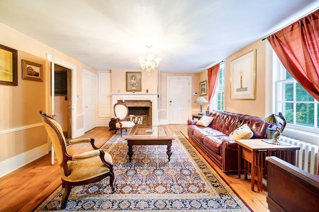 9 Ireland Ave, Wappingers Falls, NY 12590 - living area featuring light wood finished floors and a chandelier