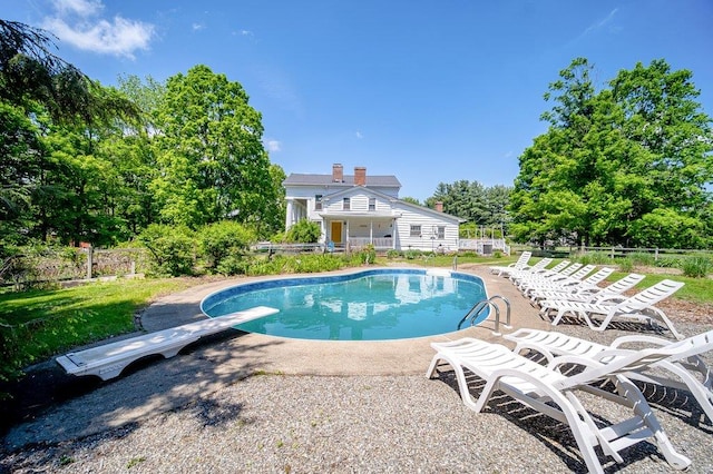 9 Ireland Ave, Wappingers Falls, NY 12590 - view of swimming pool featuring a diving board and view of scattered trees