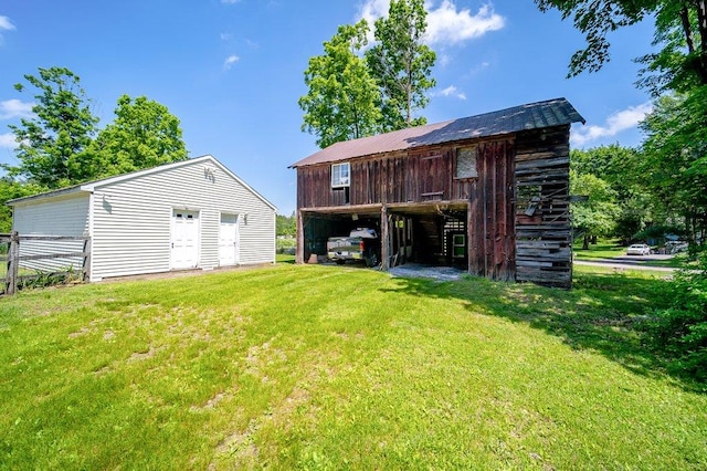 9 Ireland Ave, Wappingers Falls, NY 12590 - back of house featuring a yard and an outbuilding
