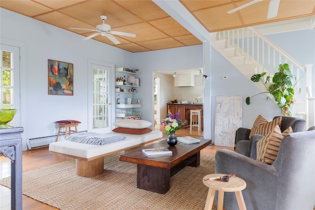 24 Jolliffe Ln, Congers, NY 10920 - living area with ceiling fan, stairs, wood finished floors, and baseboard heating