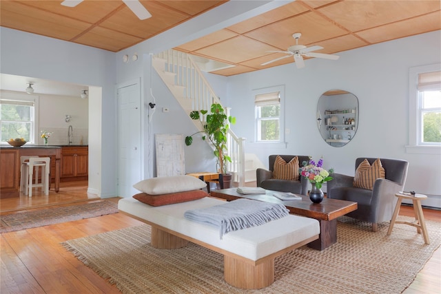 24 Jolliffe Ln, Congers, NY 10920 - living room featuring ceiling fan, light wood-style flooring, and stairs