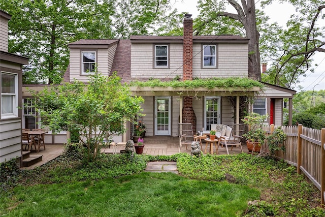 24 Jolliffe Ln, Congers, NY 10920 - back of property featuring a chimney, a deck, and roof with shingles