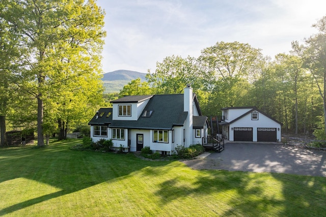 285 County Road 20, Cairo, NY 12413 - view of front of home featuring an outdoor structure, a garage, a chimney, asphalt driveway, and a front yard