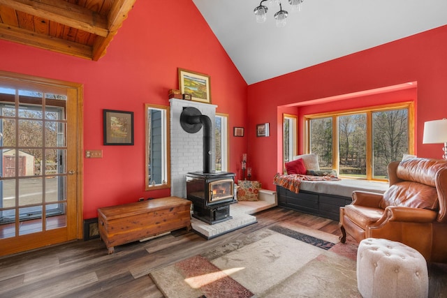 285 County Road 20, Cairo, NY 12413 - living room featuring high vaulted ceiling, wood finished floors, a wood stove, and beam ceiling
