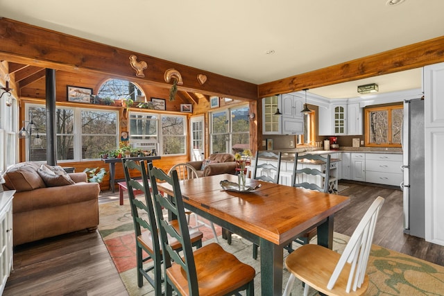 285 County Road 20, Cairo, NY 12413 - dining space featuring plenty of natural light, beamed ceiling, dark wood finished floors, and wooden walls