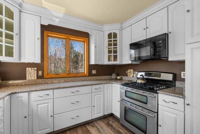 285 County Road 20, Cairo, NY 12413 - kitchen featuring black microwave, double oven range, glass insert cabinets, dark wood-type flooring, and white cabinets